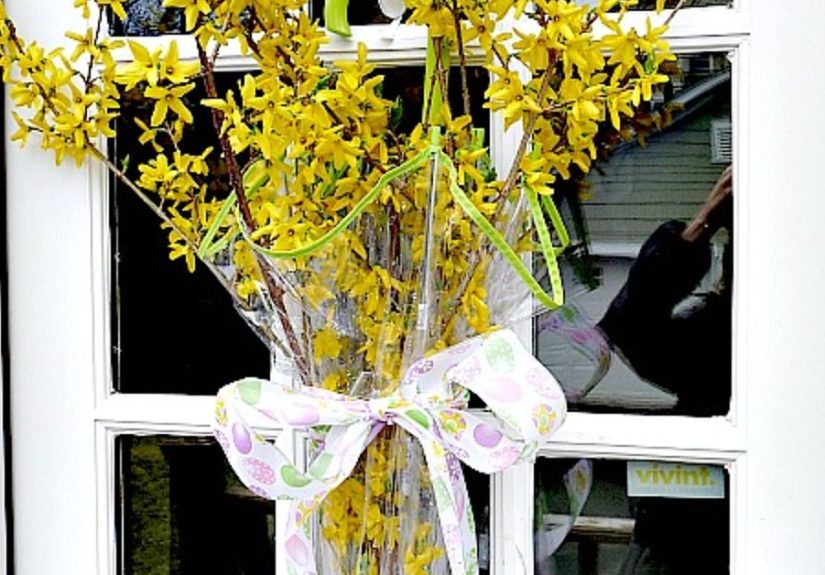 Think outside the wreath - how about a flower filled umbrella door!